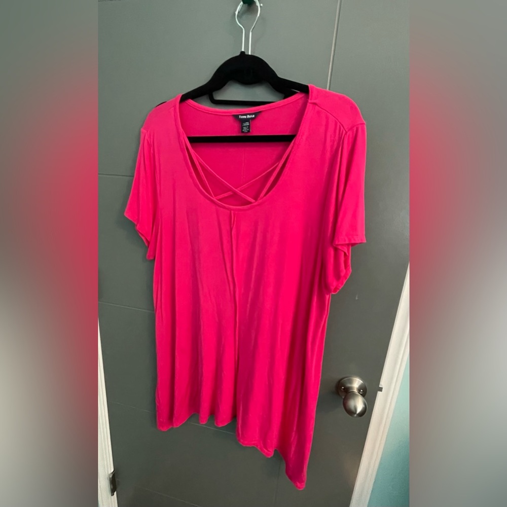 Hot Pink shirt with crisscross on the front.